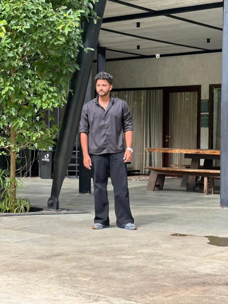 A freelance digital marketer standing in front of the office